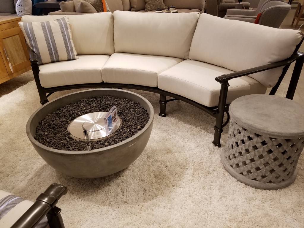 The Fremont Curved Sofa from Brown Jordan is always a hit on the showroom floor.  With the Urth Fires, you can extend the season, and toast marshmallows!